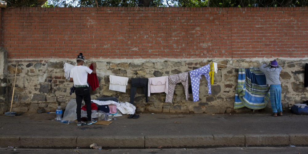 Homeless street dwellers in Cape Town. Hanging their laundry.